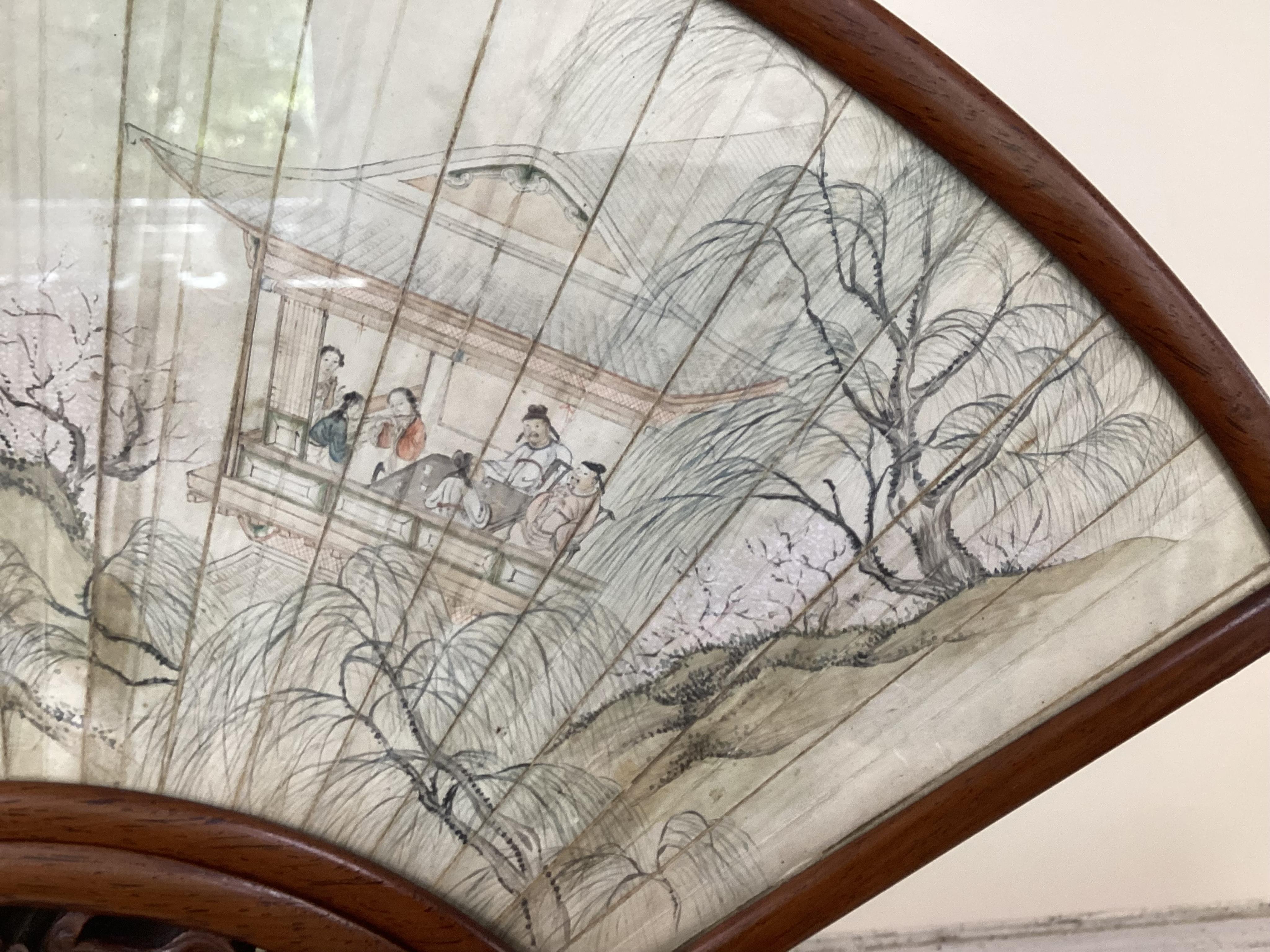 A Chinese painted leaf fan and hardwood stand, late 19th century